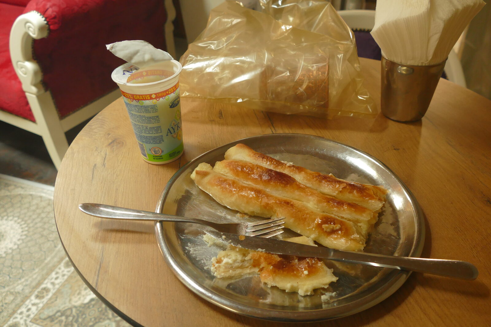 A slice of fresh Bosnian burek — meat pie in phyllo pastry — the carbohydrate that moves in serious daily volume through Sarajevo's corner pekaras.