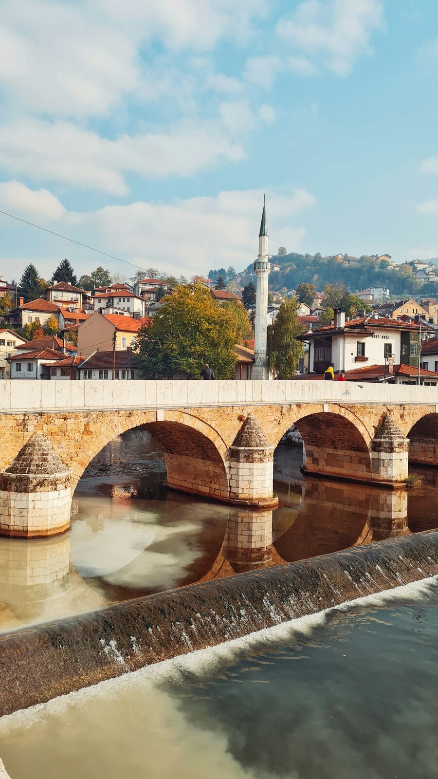 The Latin Bridge and the Miljacka river, with the buildings of central Sarajevo behind.
