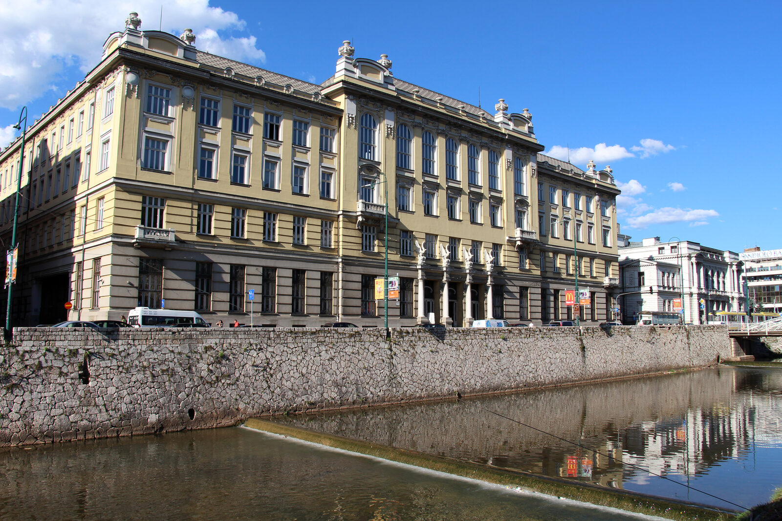 The Main Post Office of Sarajevo, a 1907–1913 Vienna Secession building by Josip Vancaš, with its rusticated stone ground floor, ornamented upper façade, and central decorative entry.