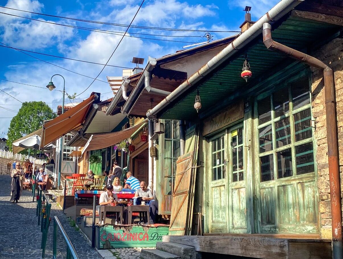 The Kovači terrace at Ministry of Ćejf, with the bazaar's rooftops visible below.