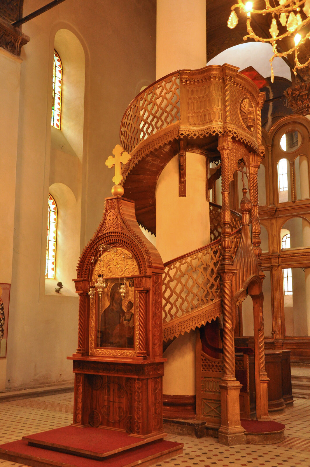 The interior of the Serbian Orthodox Cathedral of the Nativity of the Theotokos in Sarajevo — the four-tiered gilded iconostasis, the vaulted nave, and the central dome that Damjanov's team completed in 1872.