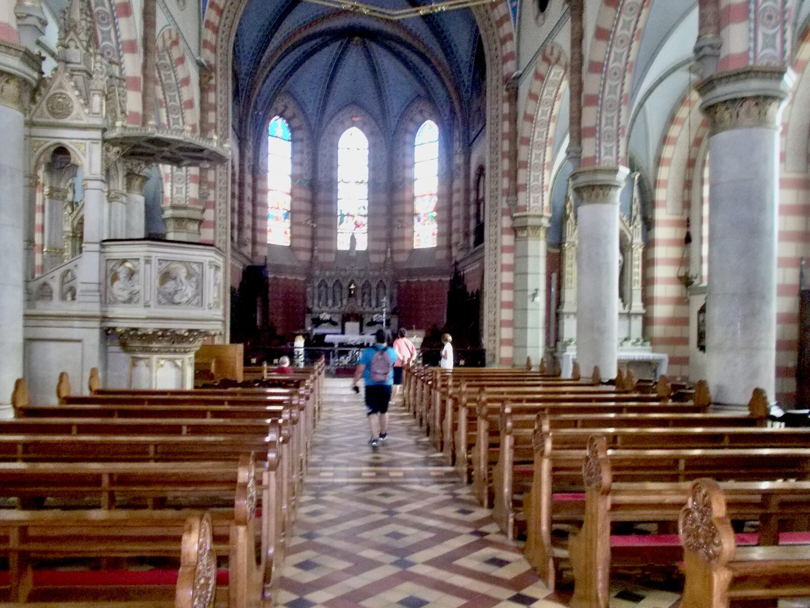 The interior of Sacred Heart Cathedral looking down the nave toward the altar.