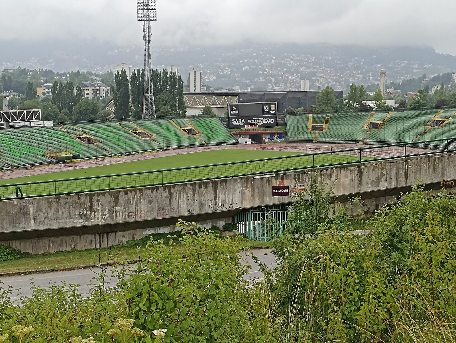 Koševo Stadium (now Asim Ferhatović Hase Stadium) in Sarajevo, a mid-sized football ground with a running track, seen from above. The 1984 Winter Olympic opening ceremony was held here on 8 February 1984.