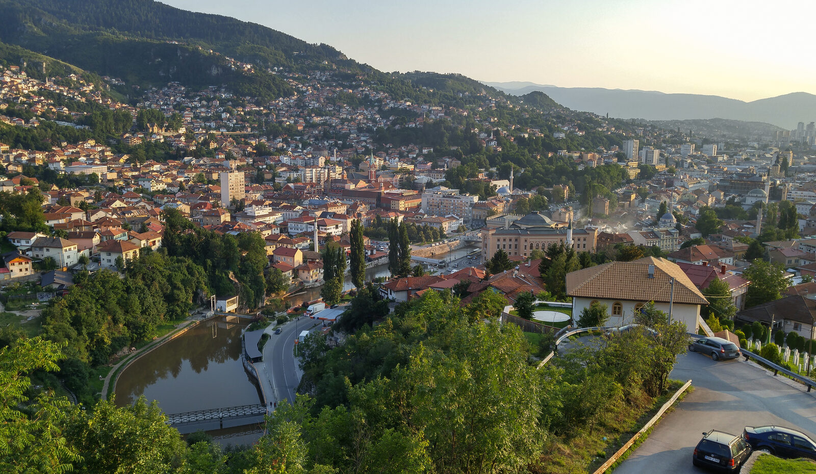A wide panorama of Sarajevo seen from the Yellow Fortress, with the bazaar and the valley laid out below.